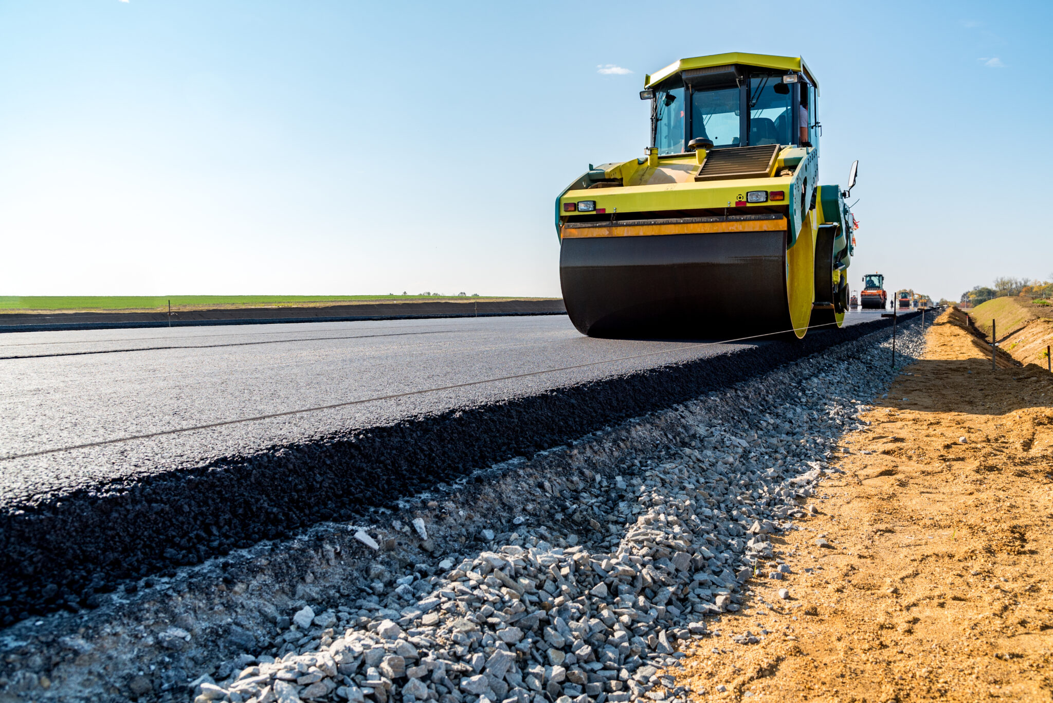 Commercial asphalt paving with heavy machinery